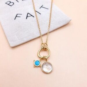 Madewell Gold necklace with blue and white charms